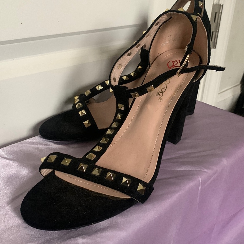 Black studded heals. Never worn